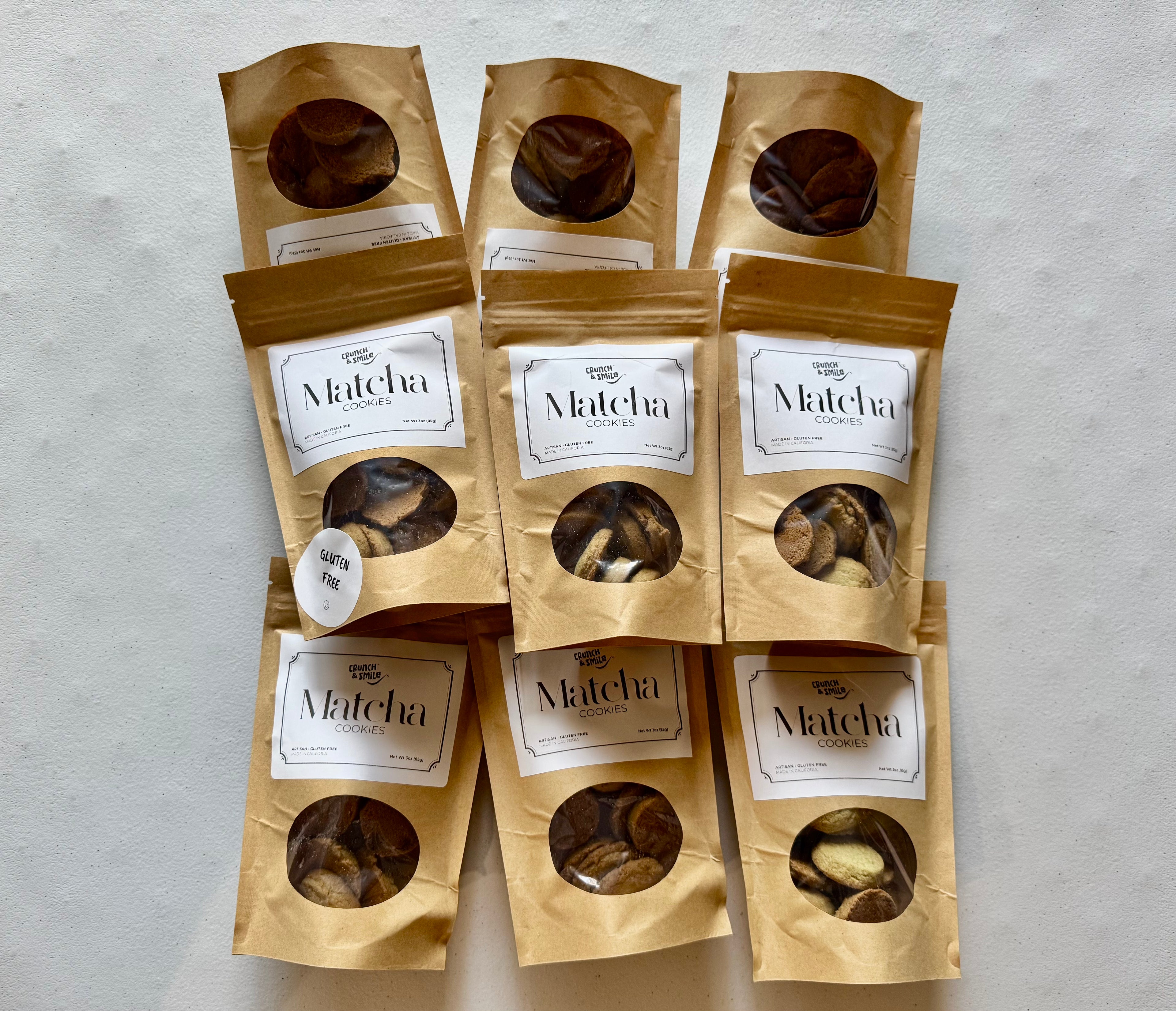 Matcha cookies sampler packs in kraft brown paper bags, gluten-free artisan cookie assortment